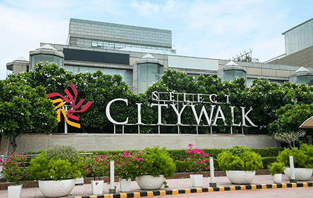 Image of the exterior of the SelectCity Walk Mall with your store sign visible: "Aswhole Ideas store sign at SelectCity Walk Mall in Delhi"